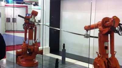 Robots showing off precision with katanas