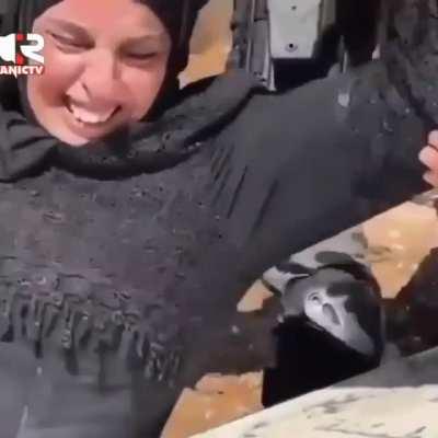 Palestinian mother trying to stop israel forces from destroying her son's grave