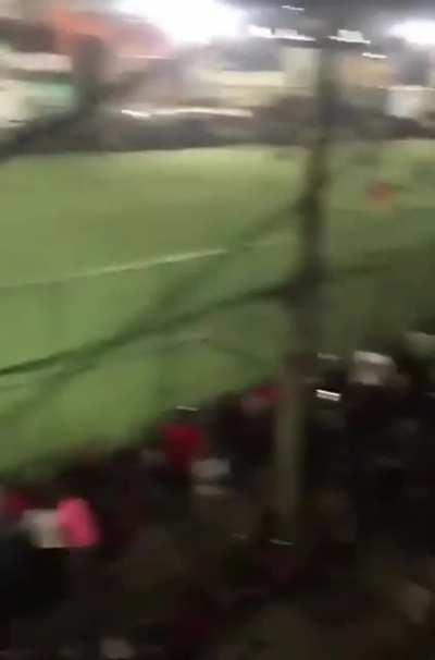 Referee makes a bad call in a soccer game in Brazil and people started blasting