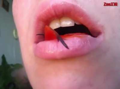 Girl Swallows A Fish Whole