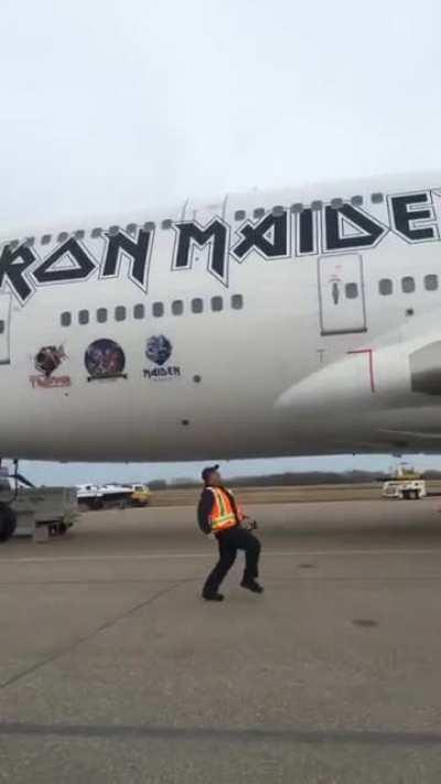 Airport ground crew having a bit of fun under Ed Force One, 2016
