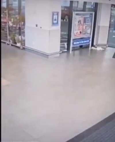 riding a cart full of plants down an escalator