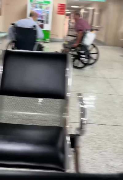 Two elderly men in wheelchairs fight in a Taiwanese hospital