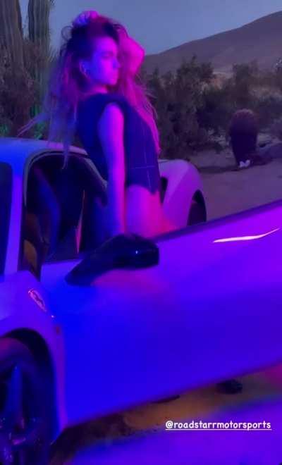 curvaceous by the car