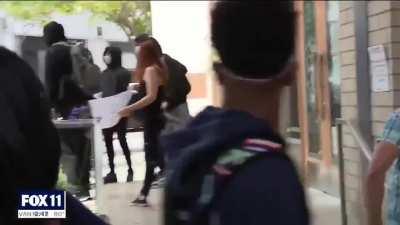 Brave protester STOPS looters