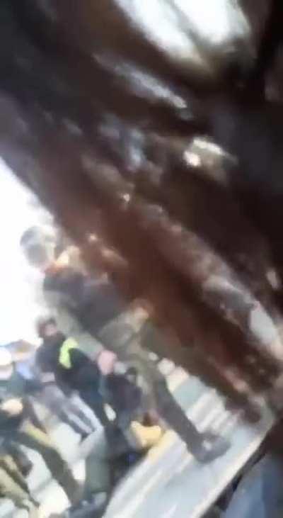 Basiji in Behesht Zahra gets hit with a projectile and starts crying and screaming on the ground