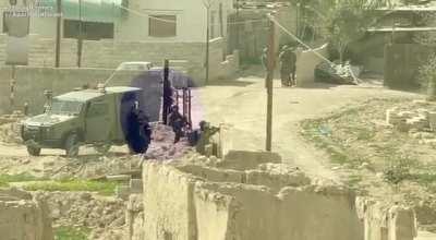 The Israeli occupation forces use a Palestinian father carrying his child as a HUMAN SHIELD whilst raiding Aqbat Jaber refugee camp in occupied Jericho. 1.3.23