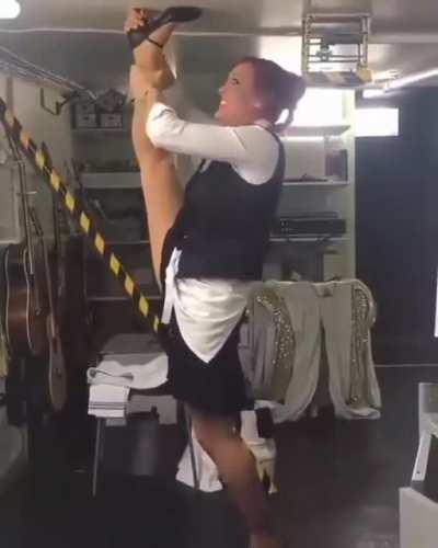 WCGW kicking high with high heels on in a short ceiling room