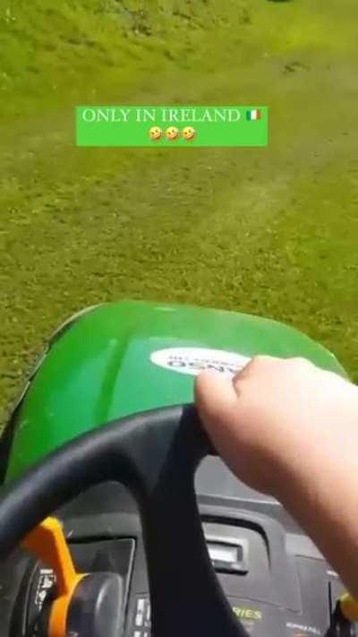 A young Chris mowing the lawn