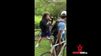 Dude chin checks a group of kids for bullying and spitting on a younger Kid