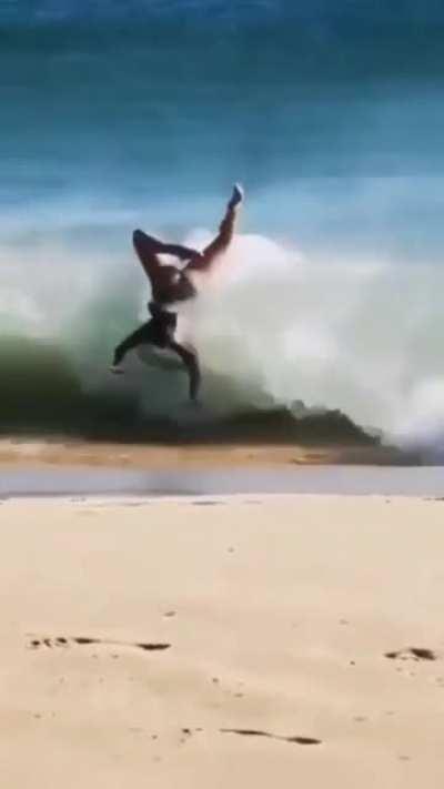 Woman gets snapped by a wave
