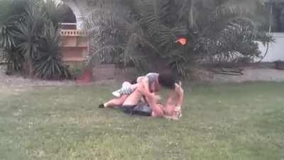 Blonde/Brunette battle in the front yard
