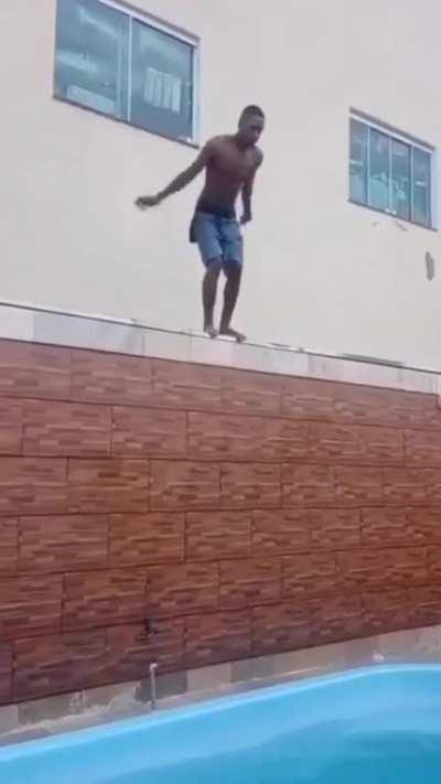 Dude tries to do a cool flip and hit his head on the edge of the pool