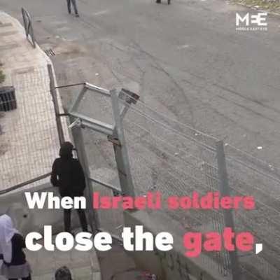 Palestinian school children fenced off from parents
