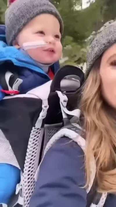 Toddler was paralyzed on the left side of his body after being hit by a car. He didn't give up learning all basic movements again & finally regain function on his left side. Hiking was the best therapy for the brave child.