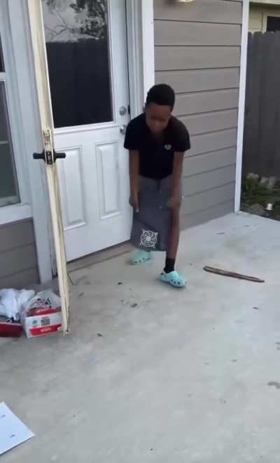 A mother is punishing her son by making him slam his PS5 the same way he had slammed her pet cat.