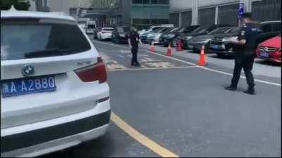 Chinese valet robot relocates illegally parked cars to legal spaces efficiently