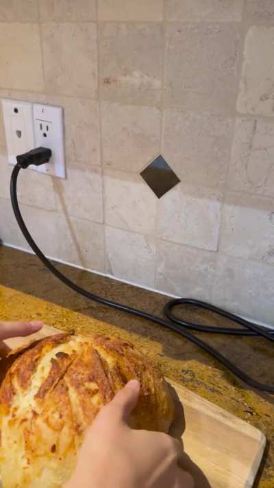 Crumb reveal of cheesy garlic sourdough