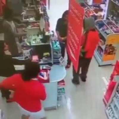 A robber steals pretending to be armed and is seized by employee who also pretends to be armed.