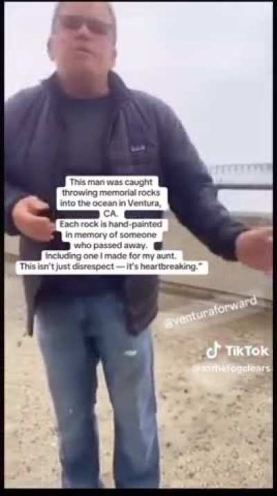 Man throwing memorial rocks into the ocean gets confronted.