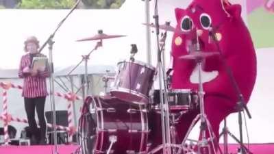 Children's concert drummer uses his costume to restrain his true powers.