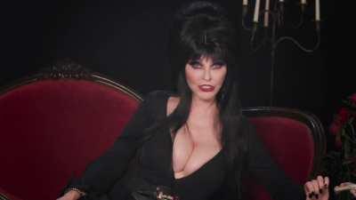 What better way to kick off October than with the big titty Mistress of the Dark herself!