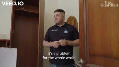 A monkey playing with a grenade