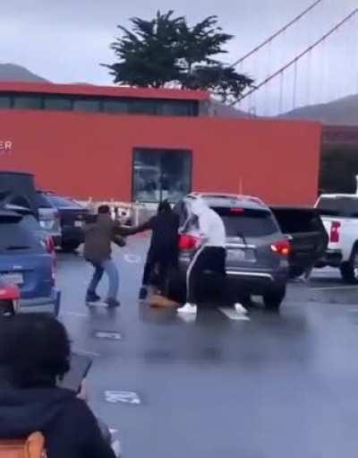Smash and grab in San Francisco, USA. Everybody has masks on! I can't tell who the robbers are.