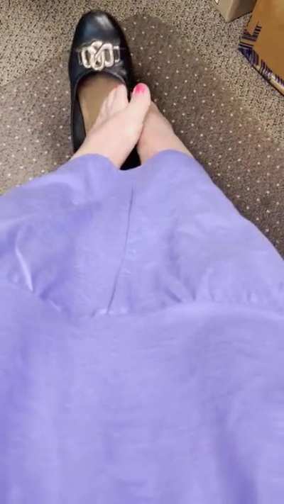 Mature revealing pretty pink toes out of flats