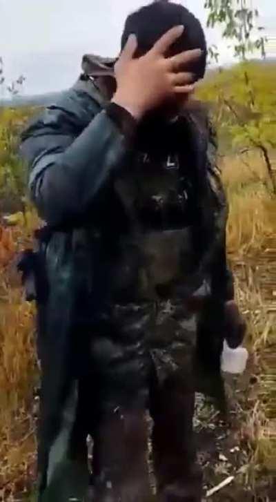 a man rests while contemplating a landscape