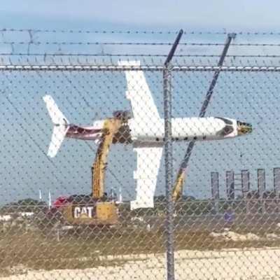 Excavator operator is having fun on a scrapyard