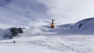 Agusta helicopter taking off from mountaintop in Valtournenche, Italy