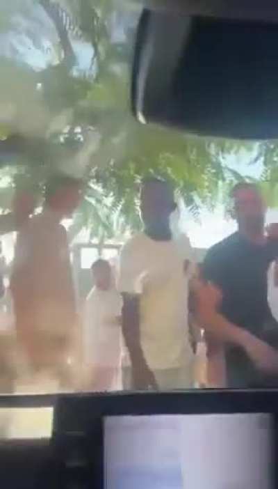 Dozens of Israelis surrounded the car of Arab-Israeli lawmaker Ayman Odeh, chanting 