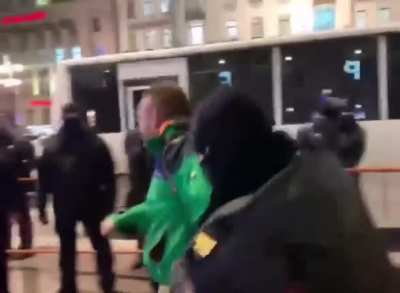 An anti-war protester getting detained by Russian police as he shouts, “Arrest Putin, not me. Damn it!”