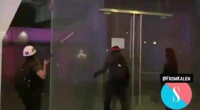 Rioters break windows in downtown Los Angeles October 6