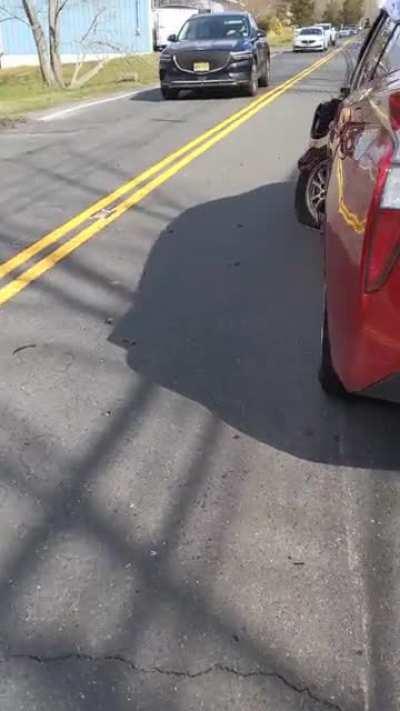 idiot thought it was safe to cross the double yellow to go around the garbage truck.