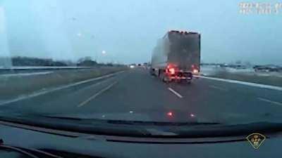 Semi tries to merge into a vehicle. Turns out said vehicle is a police cruiser.