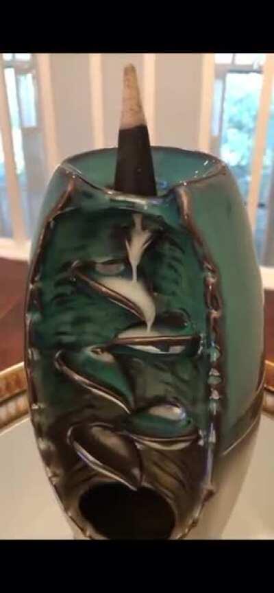 Watching the smoke drip down the waterfall from this new incense burner I got.