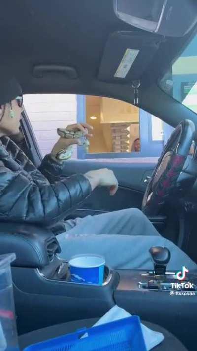 Man abuses his snake for those sweet likes