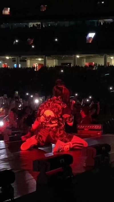 On her knees from behind