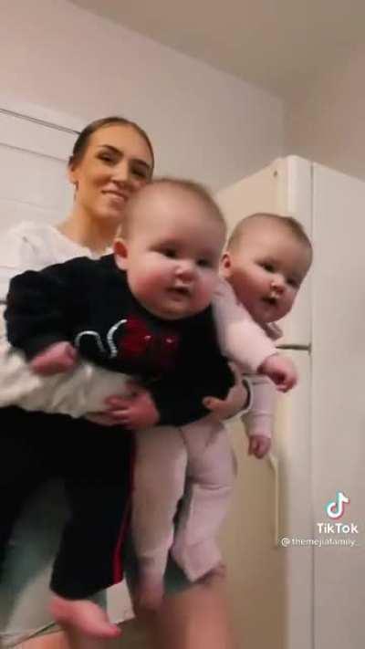 Gigantic babies or Tiny woman?