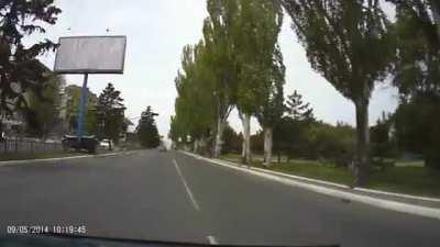[Ukraine] Military tank destroys a billboard