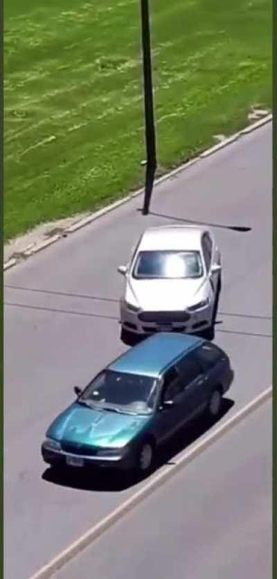 He threw a rock at the wrong car