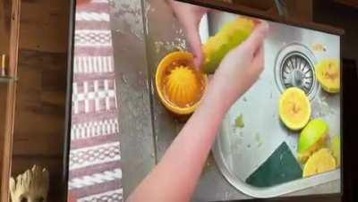 Rich girl making orange juice on a reality show