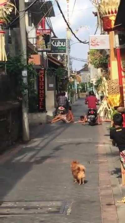 Sunbathing on a public road and refusing to budge