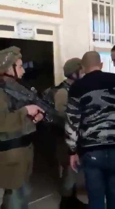 Heavily-armed israeli occupation soldiers pointing their guns to arrest a 7 yrs old Palestinian child from his school: where it suppose to be safe for children