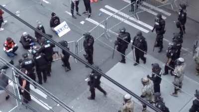 Seattle police purposely trying to provoke the peaceful demonstrators by pushing the barrier against them (13 and Pine, 8:58 PM)