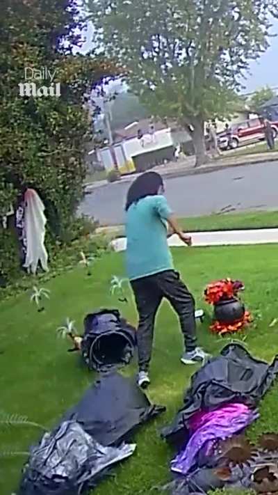 Jogger knocks down Halloween decorations for no apparent reason