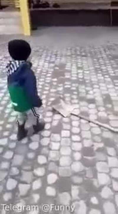 Kid kicks shovel around because why not?