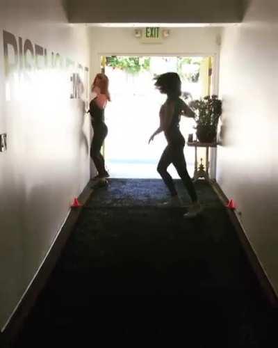 Alison Brie dancing with Betty Gilpin